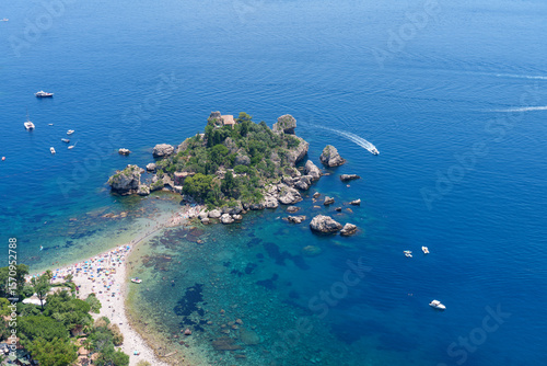 Fototapeta Naklejka Na Ścianę i Meble -  Taormina, Italy - 06232025: Isola Bella in Taormina, Sicily