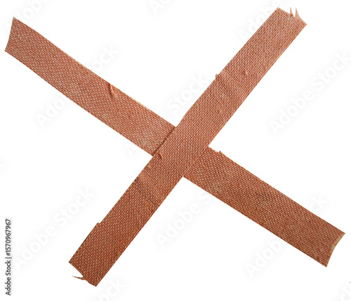 Obraz na płótnie Two strips of brown adhesive bandage tape crossed in an X shape on transparent b