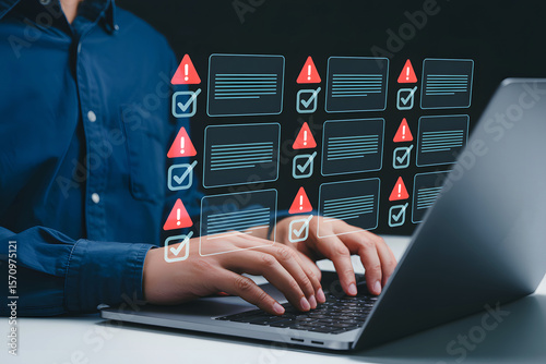 Person typing on laptop with digital checklist and warning icons hands typing computer
