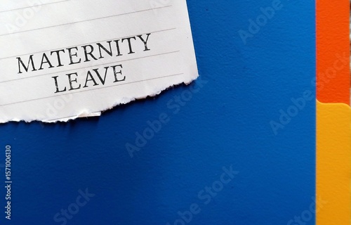Office folder with torn note written Maternity Leave - period in which female employees allowed to absent from work before and after she gives birth - to take care of newborn child