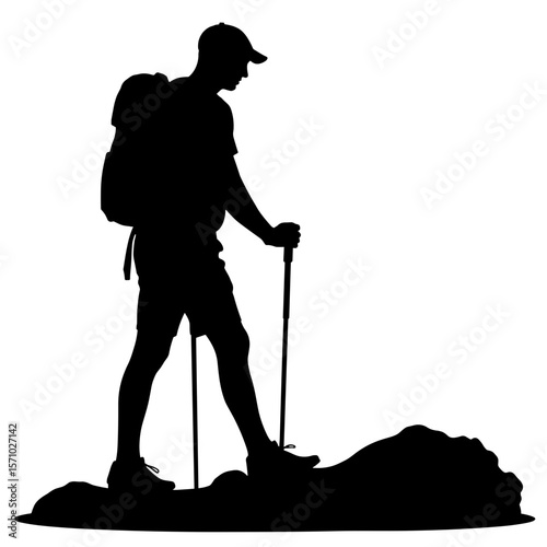 Silhouette of hiker with trekking poles on rocky terrain, outdoor adventure