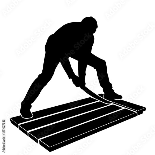 Silhouette of person installing wooden flooring, home renovation craftsmanship