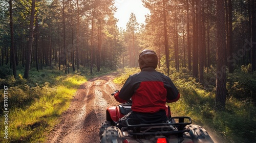 Off-Road Adventure: A Lone Rider on an ATV Exploring a Forest Trail