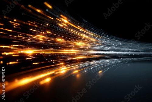 Dynamic Light Trails of Orange and Silver Against Black Background