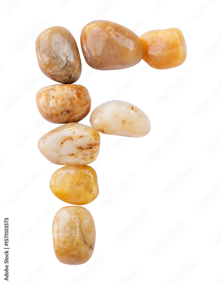 Fototapeta premium letter F is made of stone with a white background. The creative shapes of the letters of the alphabet are arranged with stones.
