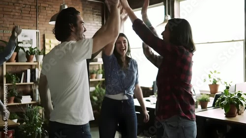 Happy coworkers walking through modern office for teamwork and collaboration