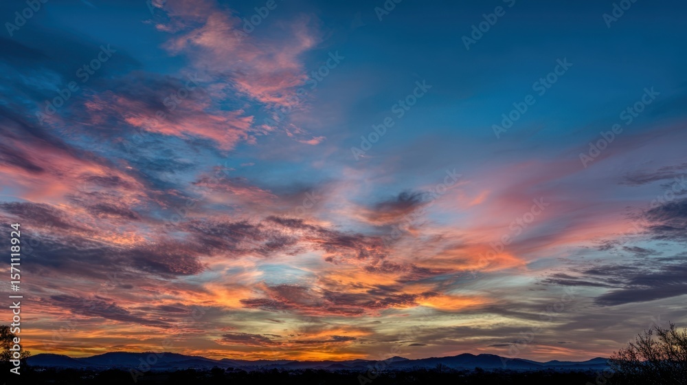 Fototapeta premium The breathtaking sunset painting the sky with vibrant colors and clouds.