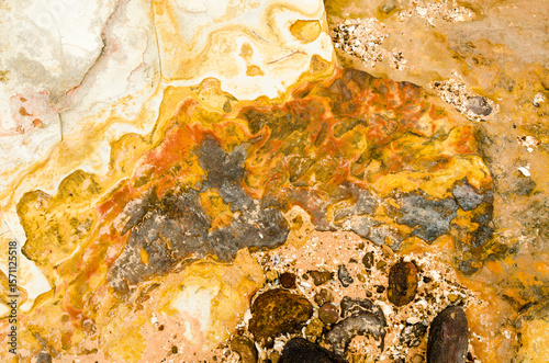Close up of marbled rock with yellow colours