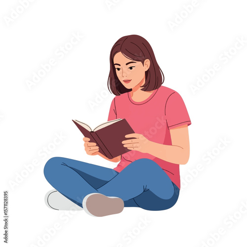 A young woman sits cross-legged, absorbed in reading a book, isolated.