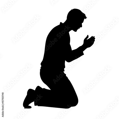 Silhouette of a Person Kneeling in Prayer