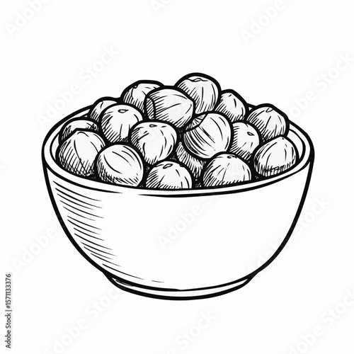 Bowl of round hazelnuts isolated on white background  