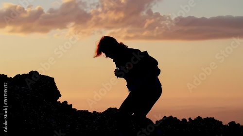 Wallpaper Mural Silhouette of a woman hiking at sunset, enjoying the tranquil scenery. Inspiring outdoor adventure for travel and lifestyle Torontodigital.ca