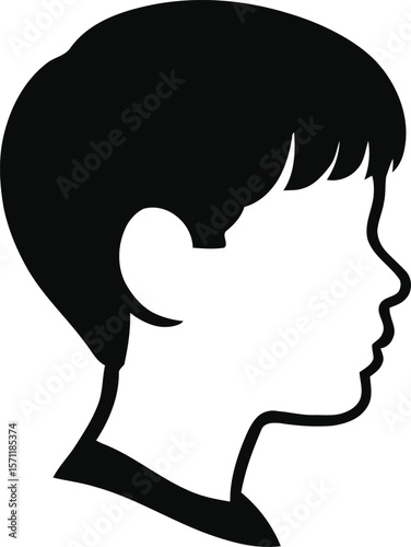 Side profile of a boy with classic short haircut in silhouette.