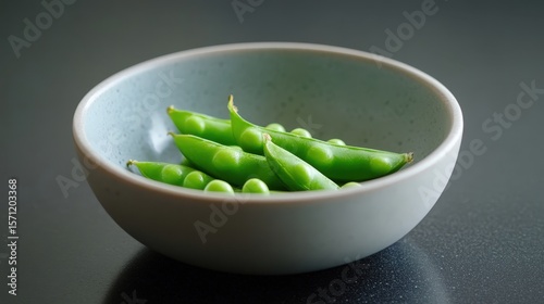 Fresh peas in their pods, ready to be steamed and added to pasta dishes or enjoyed as a simple, nutritious side dish