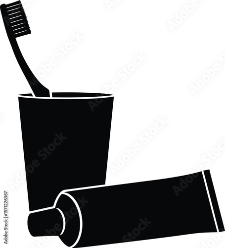 A toothbrush and toothpaste in a cup, symbolizing the daily routine of oral hygiene and dental care