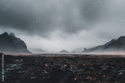 Vast, rocky landscape under a brooding sky