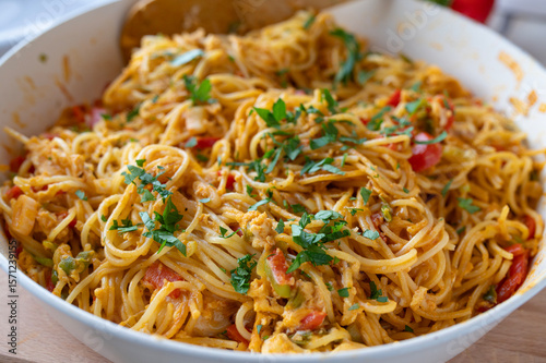 Pan Fried noodles with eggs and vegetables in a frying pan fresh and homemade cooked, 