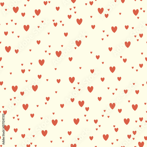 Seamless cute pattern with red hearts different sizes on light background. Pattern for wrapping paper, decoration, valentines.	
