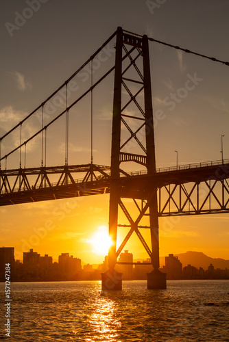 with the multicolored sunset of the Hercilio Luz bridge   of the city of Florianópolis capital of the State of Santa Catarina Brazil