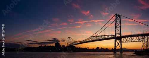 panoramic view of the sunset with the multicolored sky and the Hercilio Luz bridge postcard of the city of Florianópolis capital of the State of Santa Catarina Brazil