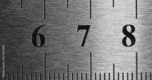 Metal Ruler Close-Up. Video featuring a detailed view of a sleek metal ruler with precise millimeter markings, captured in high clarity.