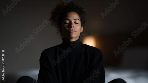 Mindfulness practice session with a young woman in a cozy indoor setting during evening hours