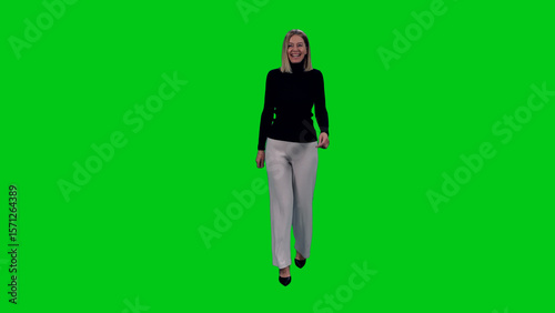 Stylish smiling middle aged woman walking on green chroma key background