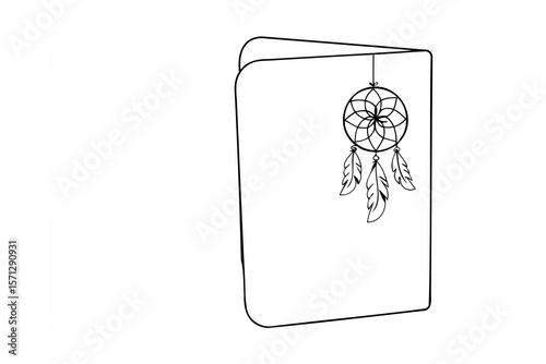 Dreamcatcher with feathers hanging from a notebook