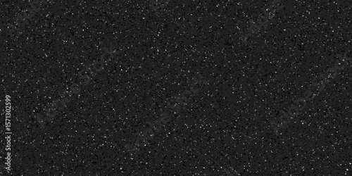 Terrazzo black background with scattered gray and white dots. Rock spatter stone marble backdrop. Black wall texture with noise overlay pattern. Vintage quartz terrazzo flooring.	