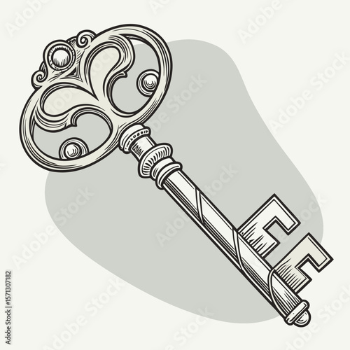 An ornate antique skeleton key with an elaborate bow and detailed bit