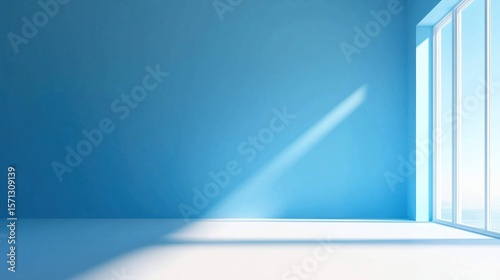 A spacious, minimalist blue room with a large window, white floor, and a shadow cast by the window on the wall.