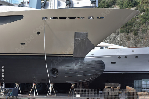 Luxury superyachts in professional boatyard  dry dock maintenance facility