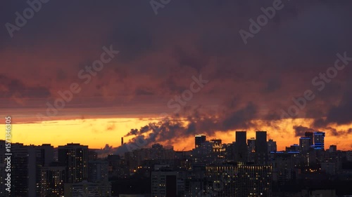 Dawn clouds over the metropolis of early winter sunset