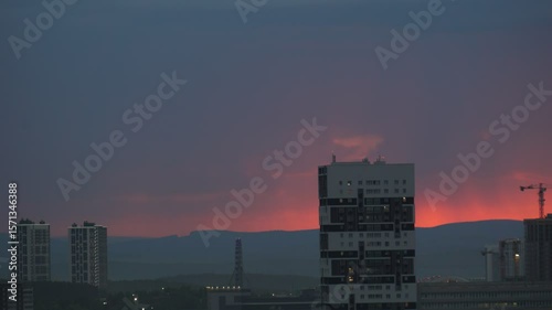 Dawn clouds over the metropolis of early winter sunset