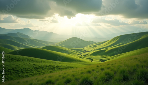 Sun Rays Over Lush Green Rolling Hills and Mountains