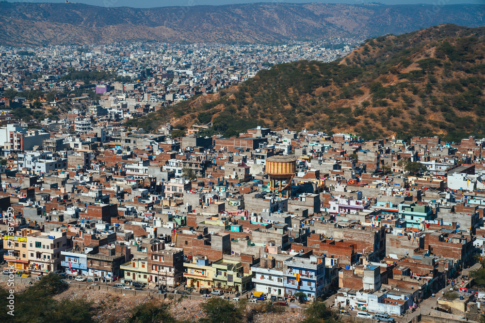 Naklejka premium Aerial View of Jaipur, the Pink City of Rajasthan – Historic Architecture, Colorful Rooftops, and Urban Landscape Surrounded by the Aravalli Hills