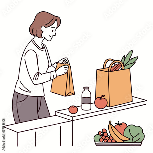 Woman Unpacking Groceries in Kitchen