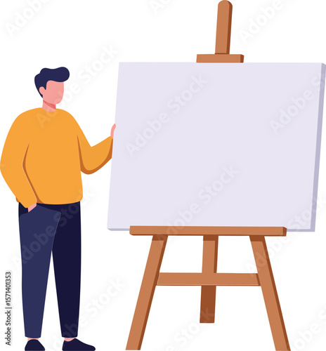 Man standing next to blank canvas on wooden easel wearing orange sweater and navy pants in creative workspace