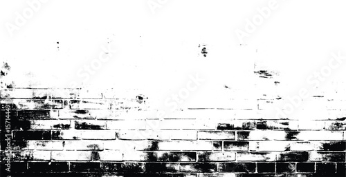 A black and white image of a brick wall with some damage and fading into white at the top portion