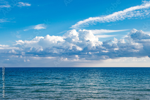 Fototapeta Naklejka Na Ścianę i Meble -  surface of sea with waves and blue sky with clouds, marine landscape