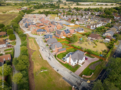 Drone view of a partially completed, exclusive housing development seen in rural Essex. The large White House at the beginning of the estate is the largest here.
