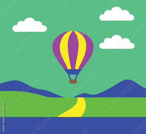Colorful hot air balloon floats over green rolling hills and a winding road