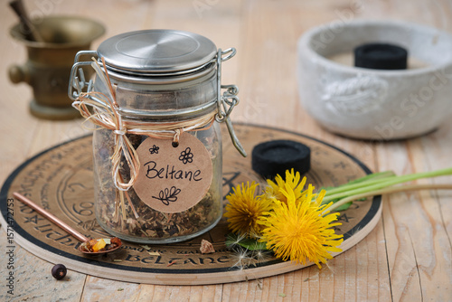 Фотография Beltane incense blend with frankincense, resins and herbs on wooden table