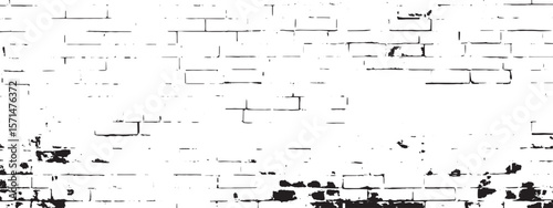 A black and white image showing a brick wall with some damage and missing pieces of the brickwork