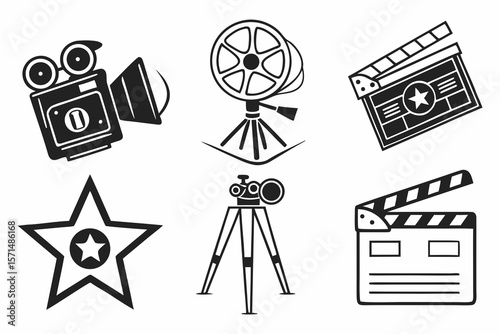 A vintage movie camera, film reel, and clapperboard are isolated