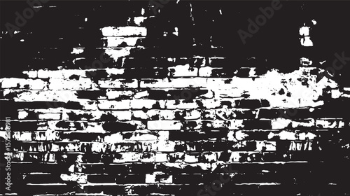 Monochrome image showing a brick wall with heavy damage and deterioration in black and white tones