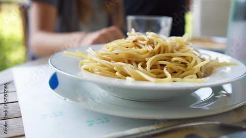plate of spaghetti served at the table