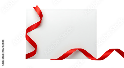 A vibrant red satin ribbon gracefully curves across a blank white square card creating a festive and elegant decorative element isolated on white background