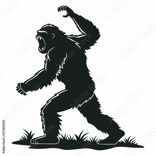 Aggressive bigfoot silhouette roaring with arm raised in defense walking in the woods