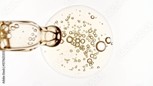 Pipette with Bubble Cluster, Cells Under a Microscope, Serum, Gel, Oi. Macro Shot of Natural Organic Cosmetics, Medicine. Production Close-up. Skin or Body Care Products. High quality 4k footage